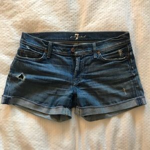 Distressed rolled up shorts